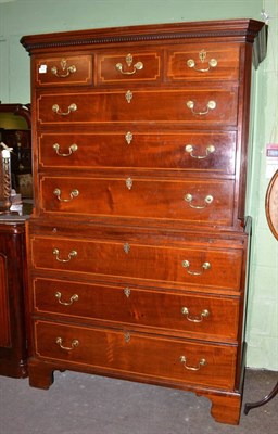 Lot 658 - A George III mahogany, boxwood and ebony strung chest on chest, circa 1800, the dentil cornice...