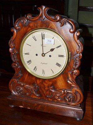 Lot 705 - A mahogany striking table clock, circa 1830, applied scroll and floral decoration, 7-1/2-inch...