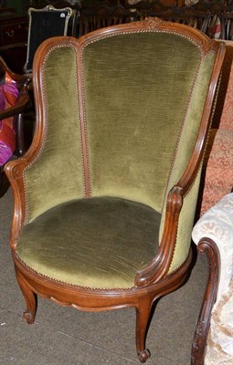 Lot 728 - ^ An early 20th century Continental oak framed armchair with four scatter cushions