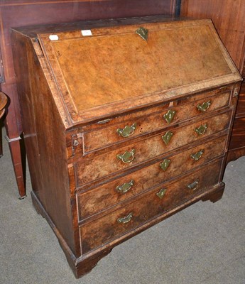 Lot 746 - George II walnut and feather-banded bureau