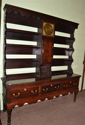 Lot 766 - An English joined oak dresser, 3rd quarter 18th century, the rack with wavy shaped frieze above...