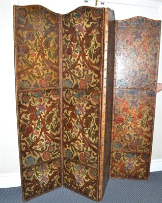 Lot 784 - Late 19th/early 20th century embossed on leather four-leaf dressing screen with black japanned...