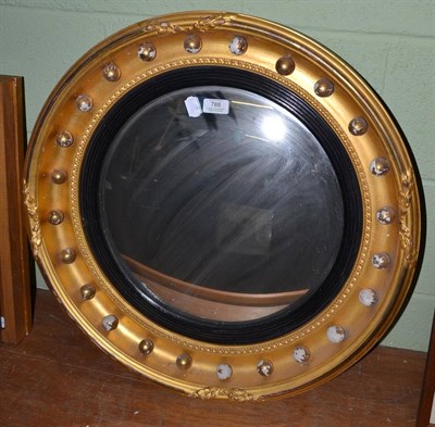 Lot 788 - A Regency style ball surmounted convex mirror