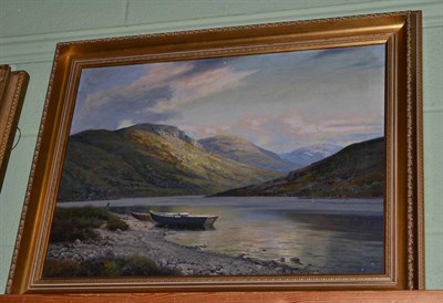 Lot 1033 - George Melvin Rennie (1874-1953) Boat moored on the shore of a loch, signed, oil on canvas, 44cm by