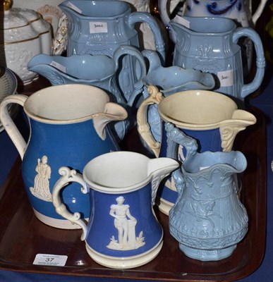Lot 37 - Staffordshire pottery blue ground jug moulded with Queen Victoria; two similar mugs, 14.5cm and...