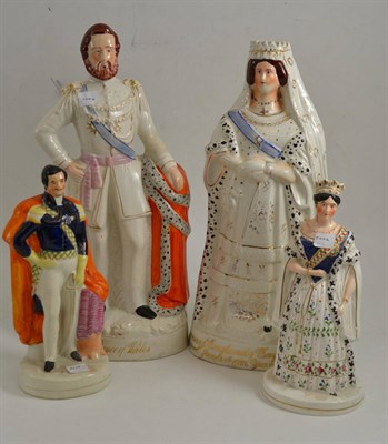 Lot 70 - A Staffordshire pottery figure of Queen Victoria, circa 1887, standing wearing crown and robes, the