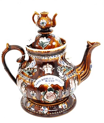 Lot 74 - A Measham bargeware Golden Jubilee commemorative teapot and cover, 1887, with teapot knop inscribed