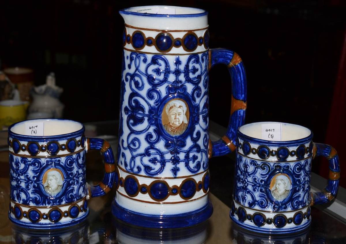 Lot 87 - Pair of Doulton Burslem pottery mugs, circa 1897, decorated with portraits of Victoria on a...