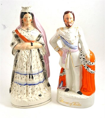 Lot 93 - Staffordshire pottery figure of Queen Victoria, late 19th century, wearing a crown and robed,...
