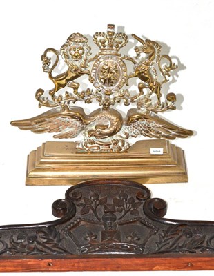 Lot 109 - A brass door stop circa 1897, cast with the Royal arms supported by an eagle on a stepped...