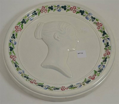 Lot 115 - A pearlware circular plaque, possibly Scottish, circa 1837, moulded with a bust of Queen...