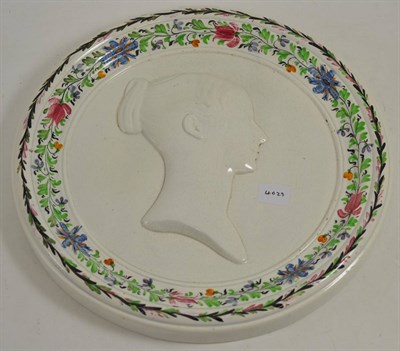 Lot 129 - A pearlware circular plaque, possibly Scottish, circa 1837, moulded with a bust of Queen...