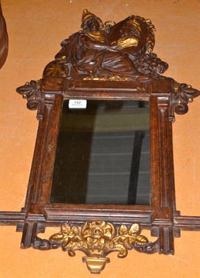 Lot 142 - A late Victorian gilt and faux tortoiseshell wall mirror, the cresting as Britannia holding a...