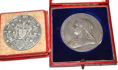 Lot 147 - A Diamond Jubilee commemorative white metal medal, 1887, cast with bust portraits of a young...