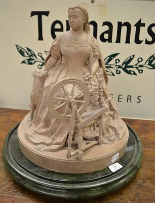 Lot 175 - A terracotta figure of Queen Victorian, dated 1869, seated at a spinning wheel with a dog at...