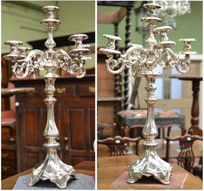 Lot 198 - A pair of imposing candelabra, stamped 84, the scroll branches supported on a square base with...