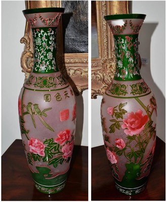 Lot 199 - A pair of Chinese overlay glass vases