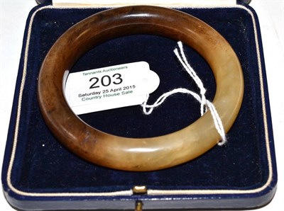 Lot 203 - A jade-type bangle