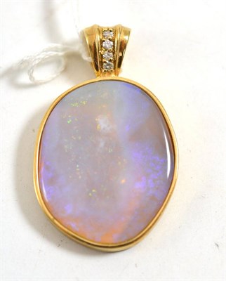 Lot 211 - A 9ct gold opal and diamond pendant, the unevenly shaped polished opal within a yellow collet...