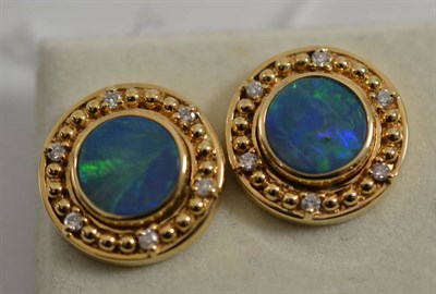 Lot 220 - A pair of opal doublet and diamond earrings, the round opal triplet in a yellow collet setting,...