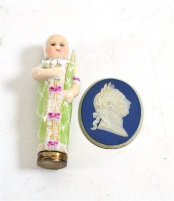 Lot 228 - A 19th century Royal Copenhagen metal mounted porcelain needle case as a child, mark in blue, 8.5cm