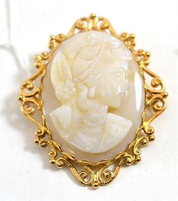 Lot 238 - A 9ct gold opal cameo brooch/pendant, carved as a maiden, with a flower in her hair, in a...