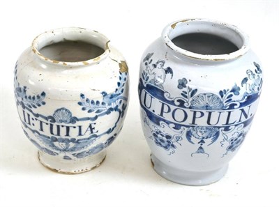 Lot 255 - An English Delft drug jar, circa 1740, inscribed in blue 'U.POPULN.' with in a cherub label, 18.5cm