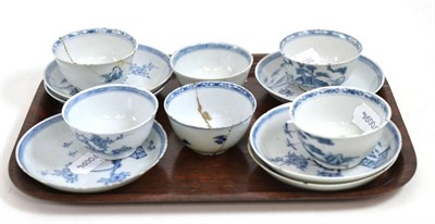 Lot 259 - A set of six Chinese porcelain tea bowls and saucers, Qianlong, painted underglaze blue with fenced