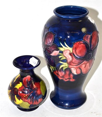 Lot 260 - A Walter Moorcroft Anemone pattern vase, on a blue ground, impressed factory marks (second),...