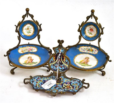 Lot 281 - A champleve watch stand, 13cm high, and a pair of Sevres-style watch stands, 16cm high