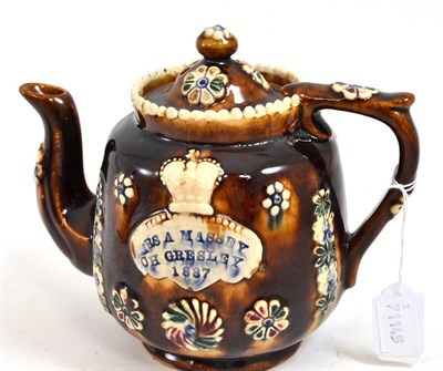 Lot 303 - A Measham bargeware teapot and cover dated 1887, inscribed ";MRS A MASSEY CH GRESLEY 1887";, 16.5cm