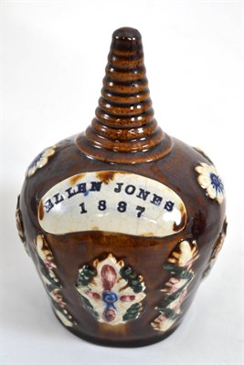 Lot 304 - A Measham bargeware money box, dated 1887, of ovoid form with ribbed neck, inscribed 'ELLEN...