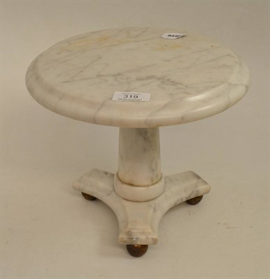 Lot 319 - A 19th century miniature marble circular table on triform base, 25cm diameter