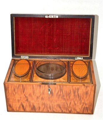 Lot 325 - A satinwood tea caddy with liner, 29cm diameter