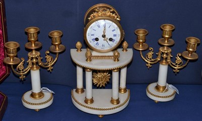 Lot 332 - A marble and gilt metal striking mantel clock with garniture, circa 1900, portico case,...