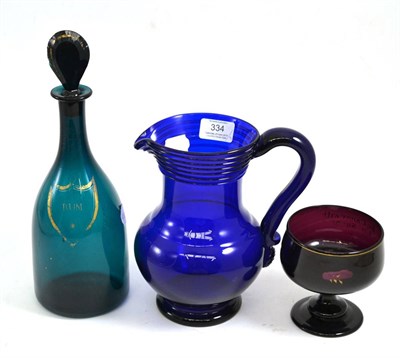 Lot 334 - Blue glass jug, green glass rum decanter and an inscribed sugar bowl