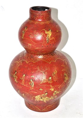 Lot 339 - A Chinese red lacquer double gourd vase painted in gilt with figures in landscapes, bears four...