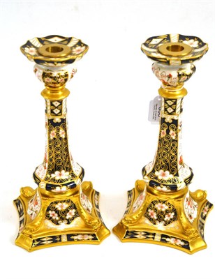 Lot 350 - A pair of Royal Crown Derby Imari pattern candlesticks with printed marks, 27cm high