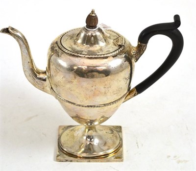 Lot 354 - A George V silver coffee pot and hinged cover, Sheffield 1910, of urn shape, engraved with a...