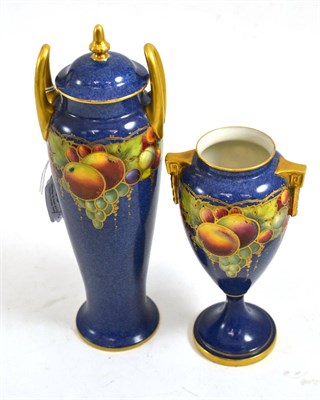 Lot 358 - Royal Worcester porcelain twin-handled vase and cover, decorated with fruit on a powder blue...