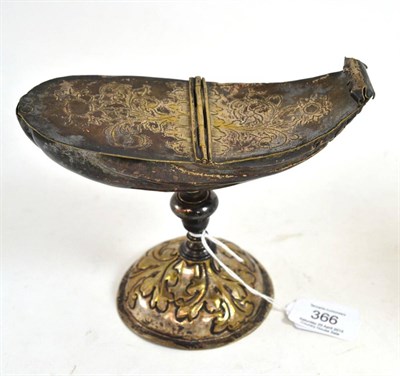 Lot 366 - A French plated brass boat, early 18th century, of shell form with hinged cover, baluster stem,...