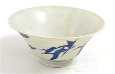 Lot 371 - A Chinese porcelain bowl, decorated with four cranes flying amidst clouds and pine trees, bears six