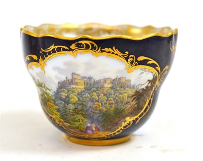 Lot 373 - A Meissen porcelain cabinet cup, 19th century, painted with ";Konigstein";, on a blue ground