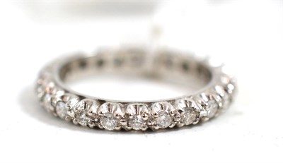 Lot 382 - An 18ct white gold diamond full eternity ring, round brilliant cut diamonds in a claw setting,...