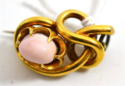 Lot 395 - A Victorian brooch set with a pale pink conch pearl-like stone - the frame as a knot motif,...