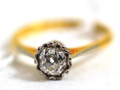 Lot 396 - A diamond solitaire ring, circa 1930, an old cut diamond in a white crimped setting, to tapered...