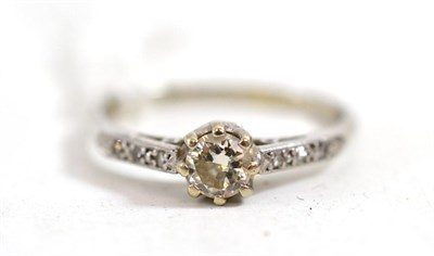 Lot 405 - A diamond solitaire ring, circa 1930, stamped 'PLAT', the round brilliant cut diamond in white...