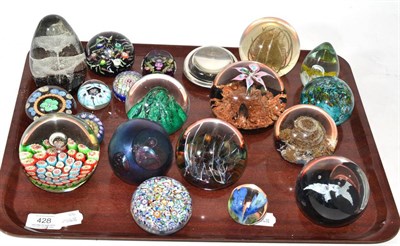 Lot 428 - A collection of twenty 20th century glass paperweights of assorted shapes and sizes, including...