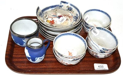 Lot 433 - A set of nine Chinese porcelain tea bowls and six saucers, painted in famille rose enamels with...