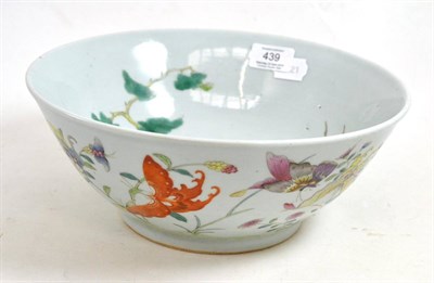 Lot 439 - A Chinese porcelain bowl, painted in famille rose enamels with butterflies amongst foliage,...